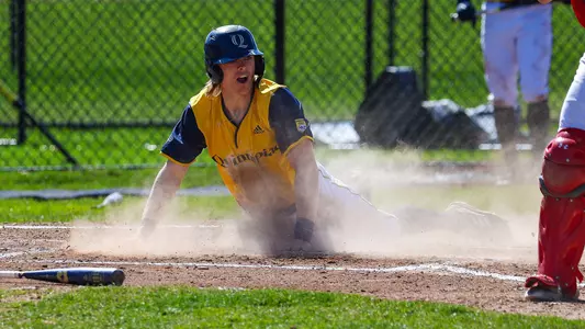 Danny Melnick slides into home plate