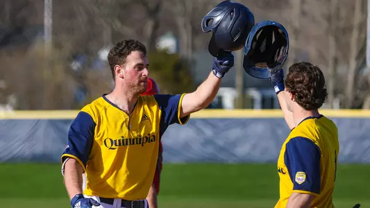 Michael Kohn celebrates a homer