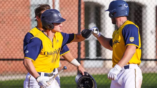 Jared Zimbardo celebrates a run scored with teammates