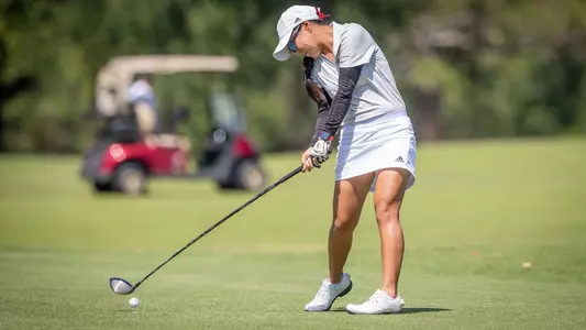 Kaylee Sakoda takes a shot from the fairway
