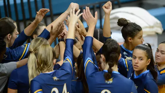 QU volleyball huddles pregame before a match