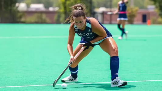 Micaela Grajales sends a pass across field