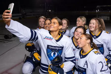 Women's ice hockey players take a selfie at media day