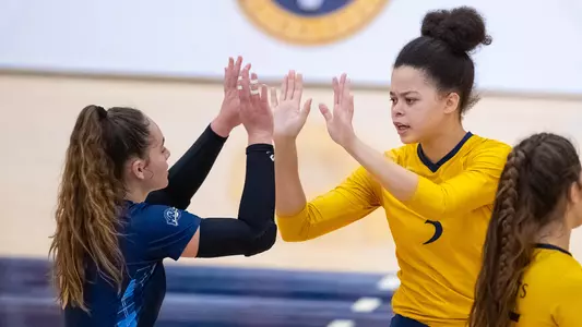 Alexandra Tennon and Faavae Kimsel Moe celebrate a point for the Bobcats
