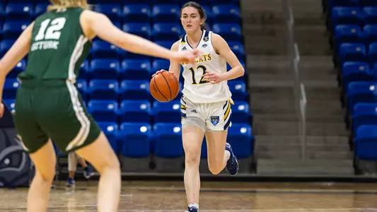 Ella O'Donnell brings the ball up the court vs. Manhattan