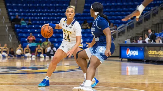 Rose Caverly crosses a URI defender