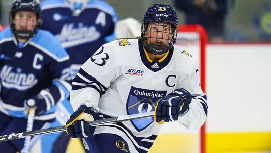 Sadie Peart skating in a game against Maine