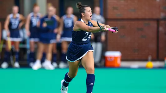 Olivia Howard celebrates a QU goal