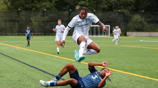 TJ Wilder jumps over a URI defender