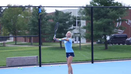 Caroline Schulson hits a serve
