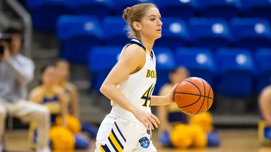 Makenzie Helms brings the ball up the court