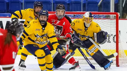 Logan Angers looks through traffic to stop a shot from St. Lawrence in Game 2 of the ECAC Quarterfinals
