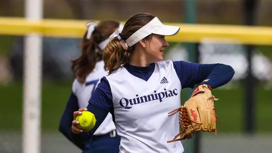 Gianna Palmisano warms up throwing with a teammate against Rider