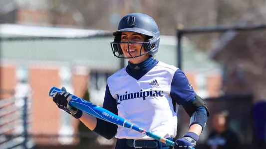 Bridget Nasir gets ready for an at bat outside of the dugout against Holy Cross