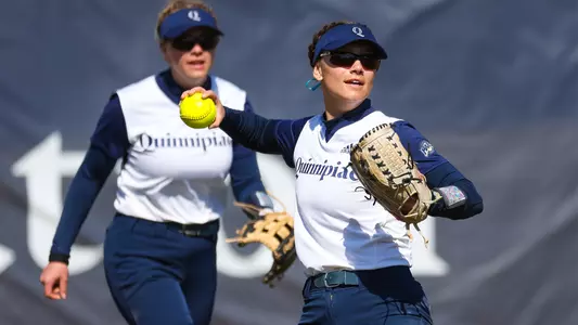 Mary Fogg fields a ball in the outfield against Holy Cross