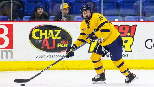 Courtney Vorster skates with the puck at M&T Bank Arena