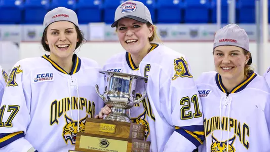 Cydney Roesler and teammates hold the 2016 ECAC Hockey Championship trophy on the ice.