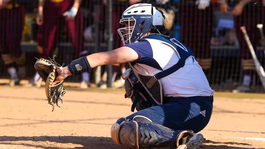 Hannah Davis prepares to catch a pitch at home plate against Iona