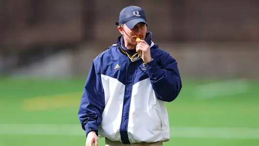 Casey Eidenshink Coaching on Sidelines During March of 2023 in Hamden