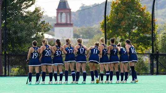 Field Hockey team watching penalty stroke