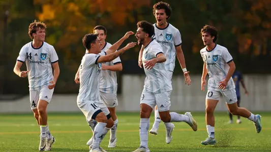 Men's Soccer celebrating a goal versus Merrimack