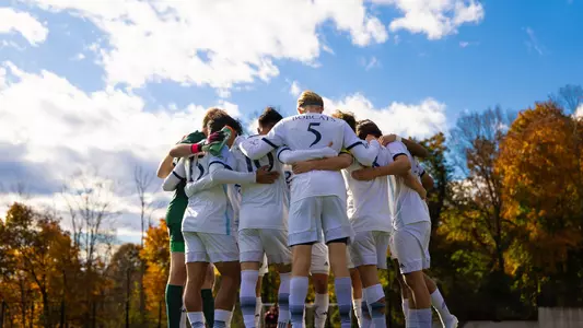 Men's soccer team huddle