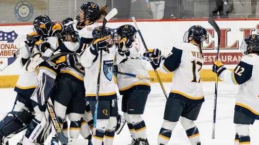 Team celebrates with goalie Felicia Frank after weekend sweep (10.18.25 in Hamden, C.T.)