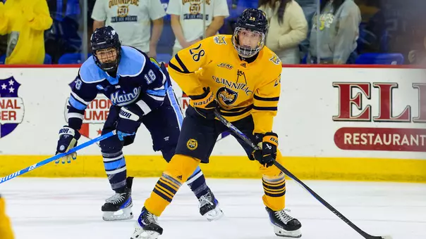 Chris Pelosi with the puck against Maine (Oct. 17, 2025 in Hamden, Conn.)
