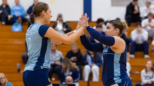 Elena Giacomini and Carola Negron Diaz High-Five in Win over Merrimack