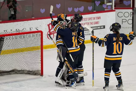 Felicia Frank celebrates shutout win with Bryn Prier and Ella Sennick (12.5.25 in Ithaca, N.Y.)