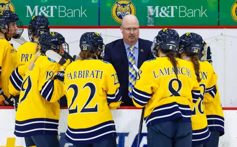 Assistant coach Brent Hill talking with Quinnipiac skaters during Maine (9.26.25 in Hamden, CT)