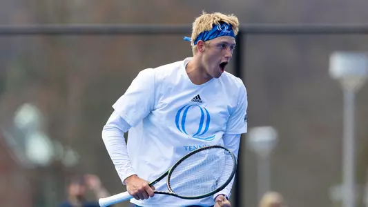 Finn Burridge celebrates a point against Niagara at the Mount Carmel Campus Courts (April 14, 2024)