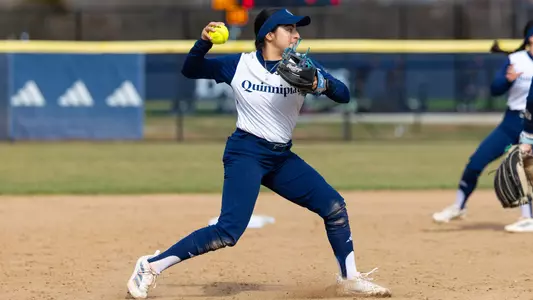 Natalia Apatiga makes a throw to first during a game in Hamden against Siena (March 25, 2025)
