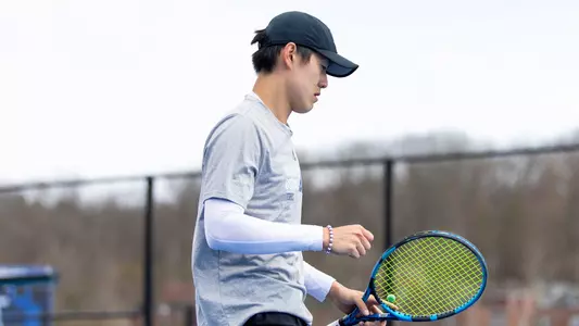 Alex Yang fist pumps after a point in match in Hamden against Merrimack (March 29, 2025)