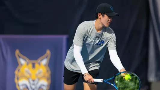 Alex Yang prepares to hit in a serve in match against Merrimack in Hamden (March 28. 2025)