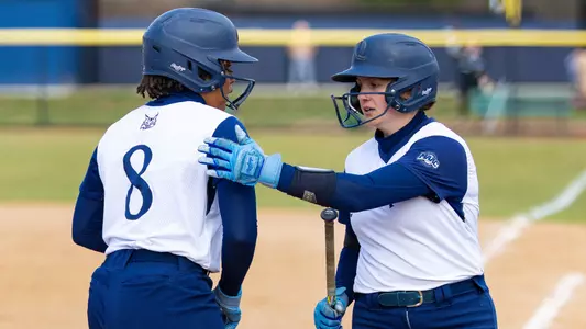 Brooke Hilliard and Mia Rubirosa talk during a game against Siena in Hamden (March 25, 2025)