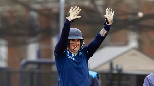 Aryn Bombery celebrates a hit in a game against Mount in Hamden (April 13, 2025)