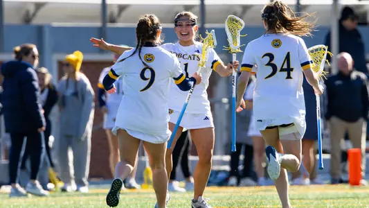 Emma Miller-Ayala Celebrates a Goal with Teammates vs. Merrimack (April 9, 2025 in Hamden, Conn.)