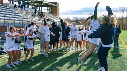 Megan Felker and Sophia Prouty Jump in Celebration Postgame vs. Canisius (April 16, 2025 in Hamden, Conn.)