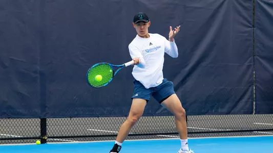 Alex Yang hits a forehand in a match against Rider in Hamden (March 30, 2025)