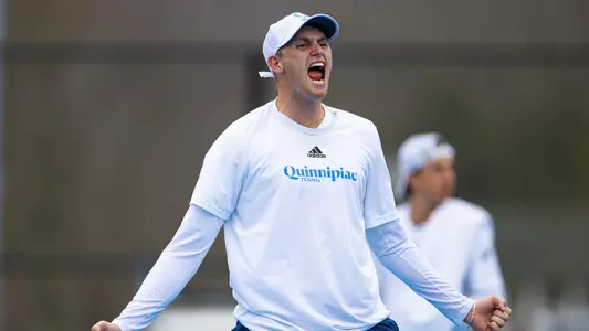 Finn Burridge celebrates a point in a match against Rider in Hamden (March 30, 2025)
