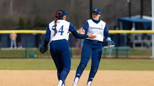 Jaclyn Gonzalez and Brooke Hilliard high five in a game against Siena in Hamden (March 25, 2025)