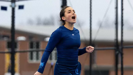 Willow Renton celebrates a point in match against Rider in Hamden (March 30, 2025)