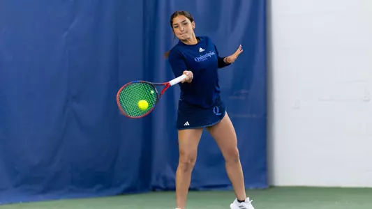 Willow Renton hits a forehand in match against Mount in North Haven (April 12, 2025)