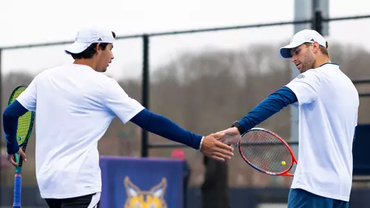 James Lorenzetti and Daniel Velek high five in a match against Rider in Hamden (March 30, 2025)