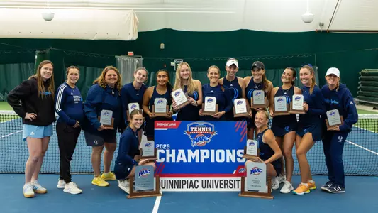 Quinnipiac Women's Tennis posing with 2025 MAAC trophy (April 27, 2025)