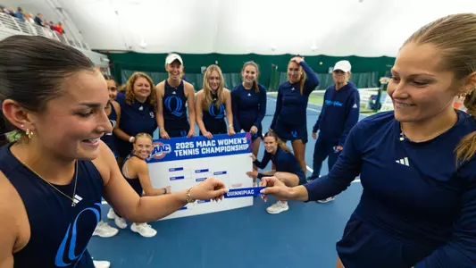 Willow Renton and Jordan Bradley put champion sticker on MAAC board (April 27, 2025)