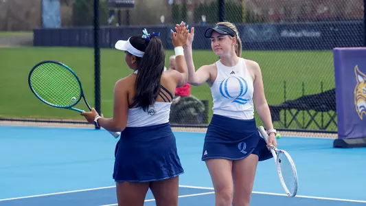 Vera Sekerina and Anagha Shankar celebrate a point in a match against Siena in Hamden (April, 4, 2025)