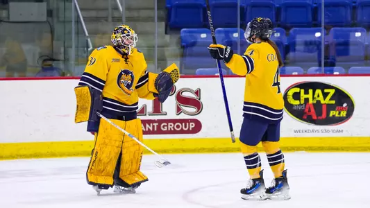 Kendall Cooper and Kaley Doyle hug after a win in a game in Hamden against Union (2/15/2025)