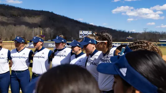 QU softball huddle before a game versus Siena in Hamden (March 25, 2025)